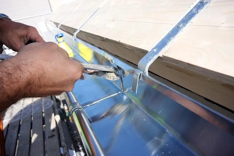 Can I install gutter brackets on my own?